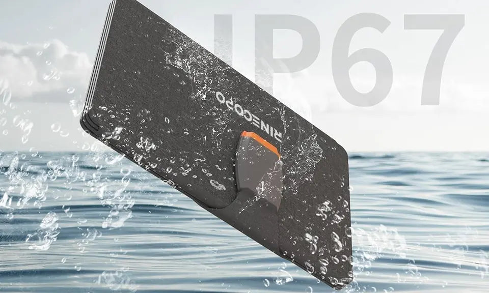 A Rinecopo portable solar panel demonstrating its IP67 waterproof rating with splashing water. This rugged, dust-proof, and water-resistant solar charger is built for marine environments, beach camping, and extreme outdoor adventures in all weather conditions