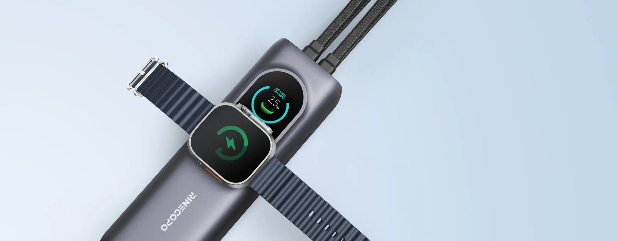A high-angle view of the Rinecopo power bank wirelessly charging an Apple Watch Ultra. The smart LED display shows a real-time 2.5W wireless output, highlighting the built-in magnetic charger that eliminates the need for extra cables during travel