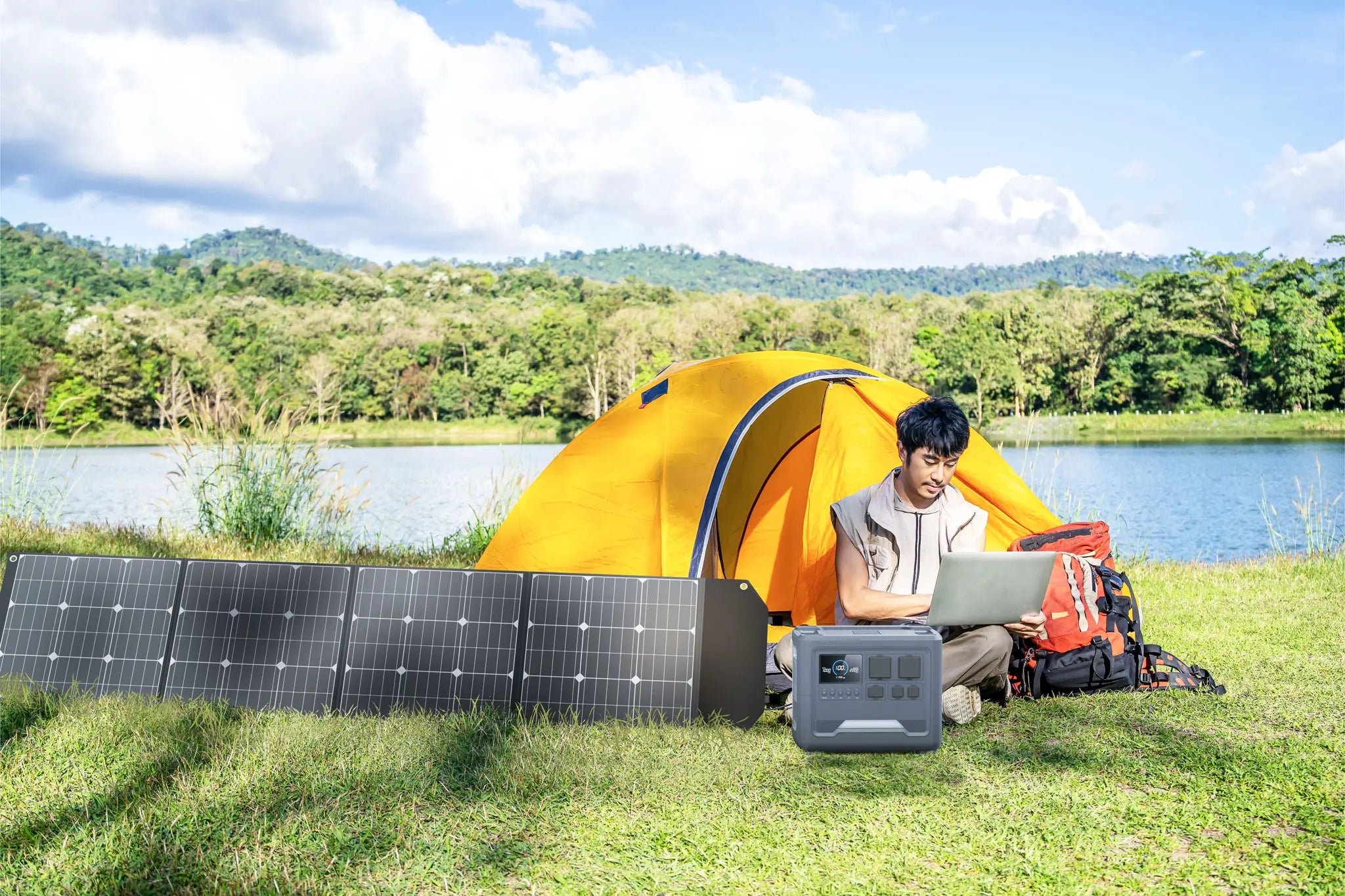 A traveler using a Rinecopo portable solar generator and foldable solar panels to power a laptop while camping by a lake. This off-grid energy solution is perfect for digital nomads, outdoor enthusiasts, and emergency backup power, ensuring clean energy anywhere