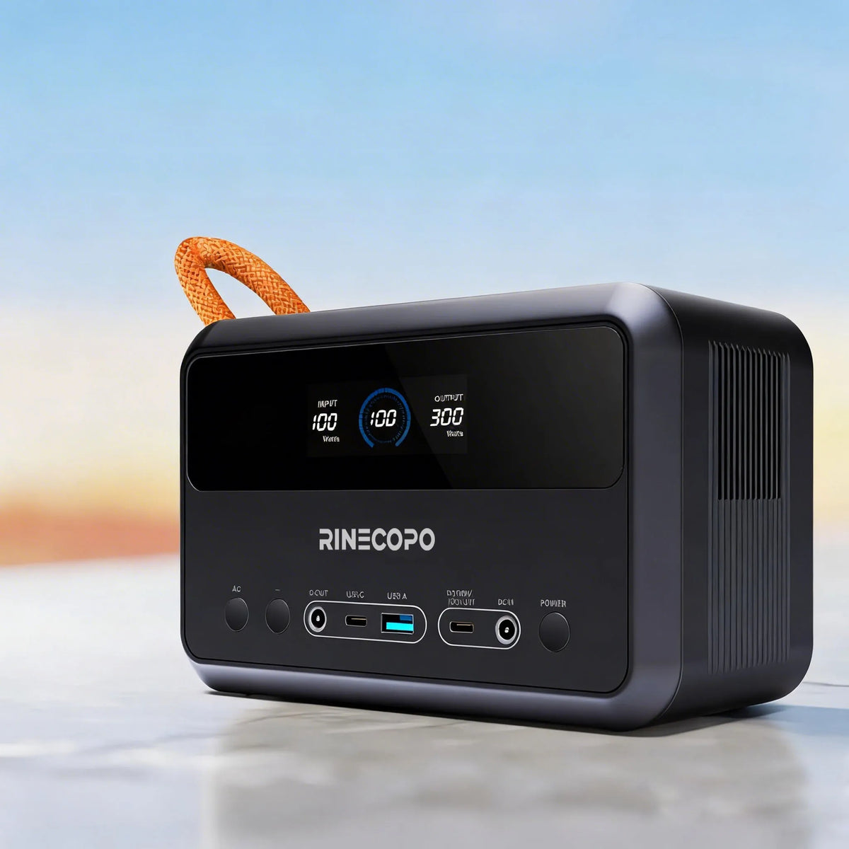 RINECOPO 300W portable power station resting outdoors by the water, perfectly sized for minivans and ready for dual charging via car or solar panels to eliminate power anxiety.