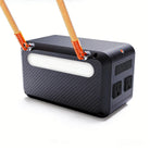 Back angle of the RINECOPO 300W portable power unit showing its sleek, low heat loss design and the flexible replaceable shoulder strap for effortless on-the-go carrying.