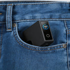 RINECOPO super compact 140W GaN charger slipping easily into a jeans pocket, perfect for travel